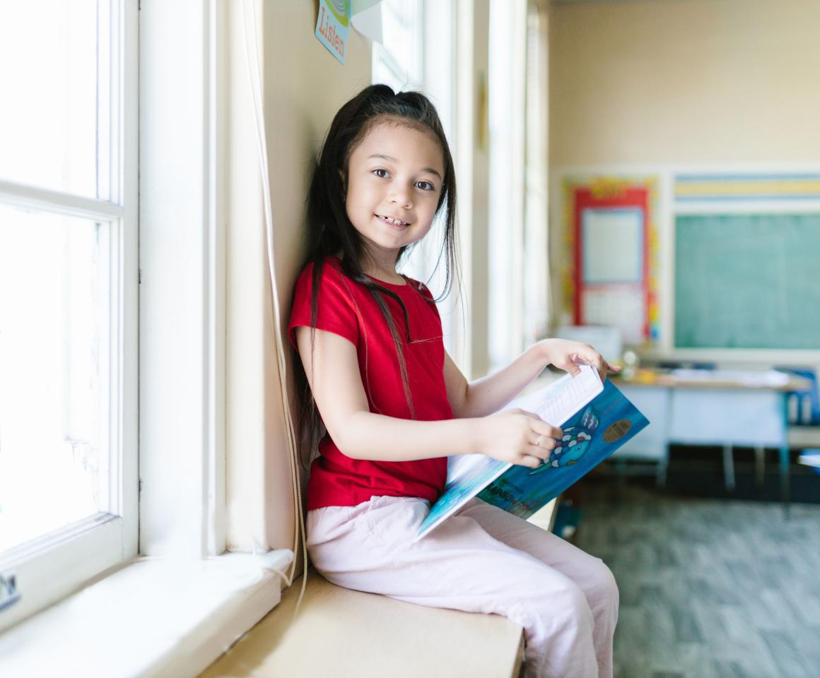 kid reading a book